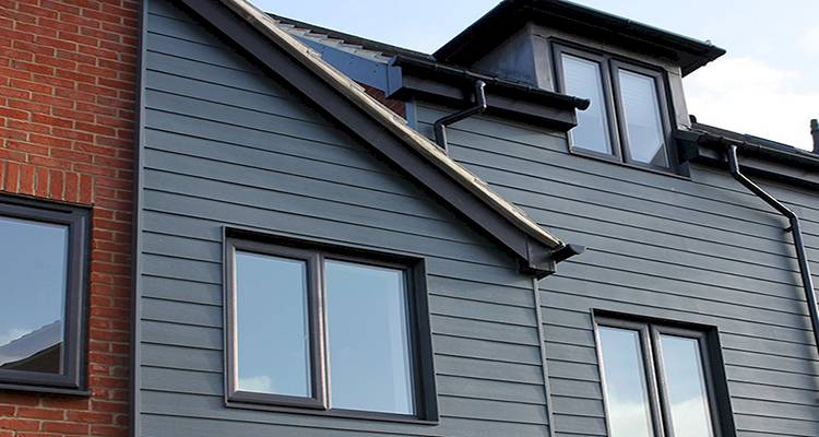 Anthracite grey uPVC windows on modern Swansea home installed by Lion Guard Installations Ltd